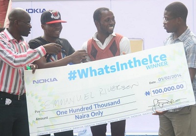 L-R: Olajide Adeyemi, Retail Marketing Manager, Nokia West Africa; star rapper, Olamide; Emmanuel Riverson, N100,000 winner of the What’s In the Ice competition, and Airiafo Oriunuebho, Communications Manager, Nokia West and Central Africa, during the launch of the new Nokia Asha ICE range held at the E-Centre, Yaba.